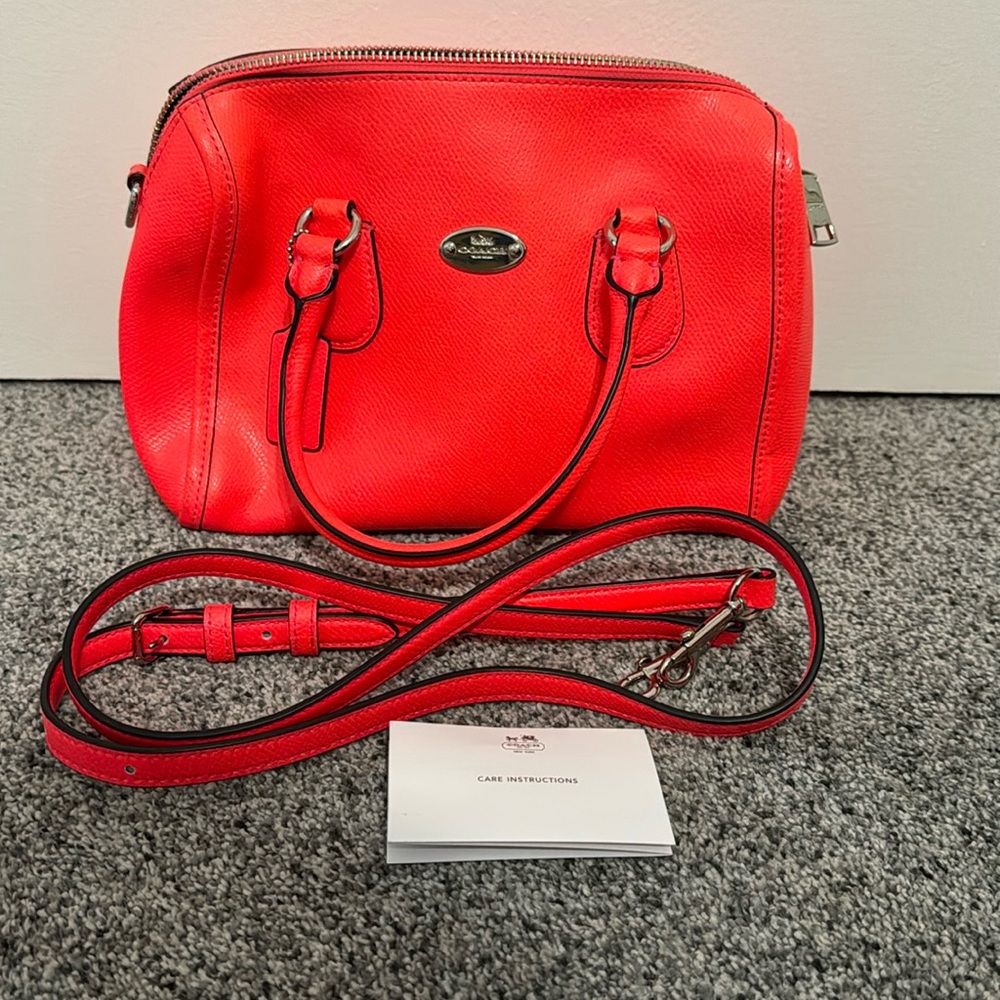 Coach bright pink handbag that can used as a crossbody bag